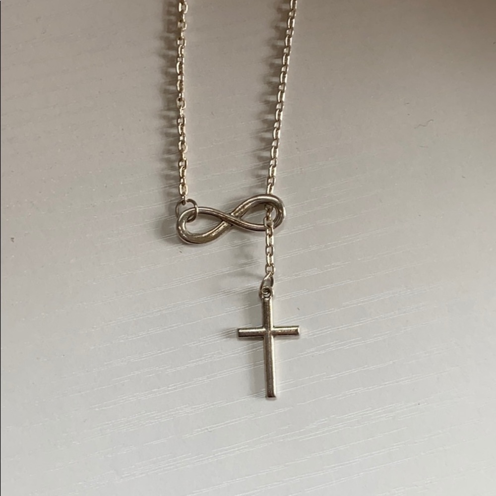A sliver infinity cross necklace